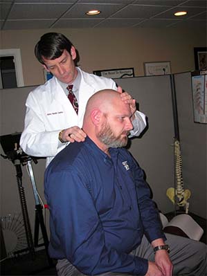 Chiropractor Cary NC Jeff Lissenden With Neck Pain Patient